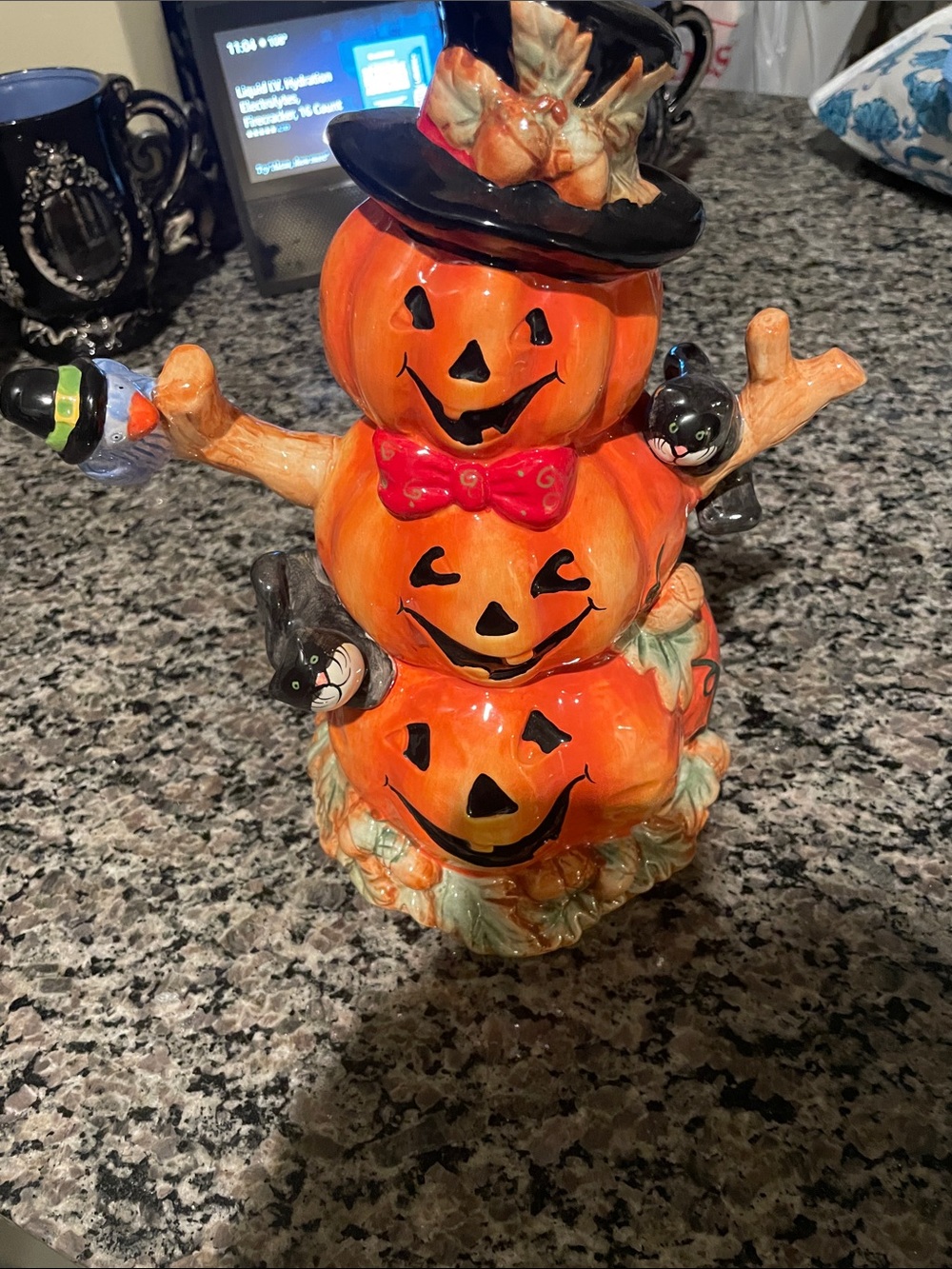 Stacked Orange Pumpkin Figurine with Black Hat and Red Bow
